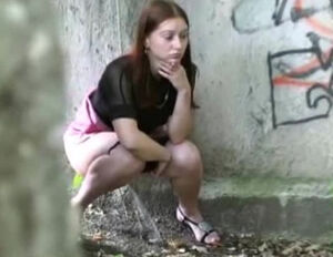 Brown-haired Czech damsel pees off the fence
