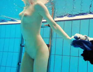 Porno shooting underwater. Bare Nubile disrobes off her
