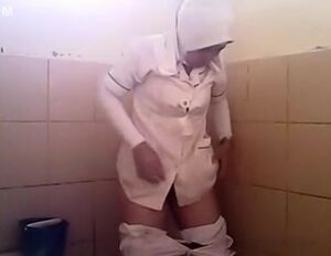 Arab dame heads urinate in a public restroom